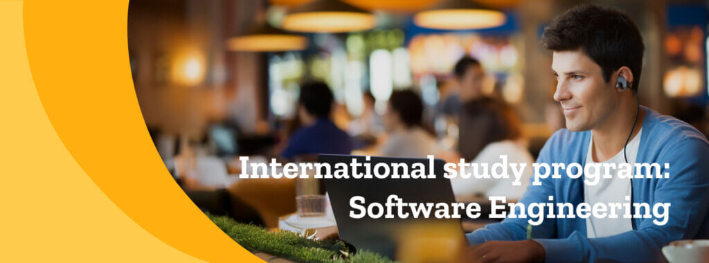 International student in university library studying Software Engineering